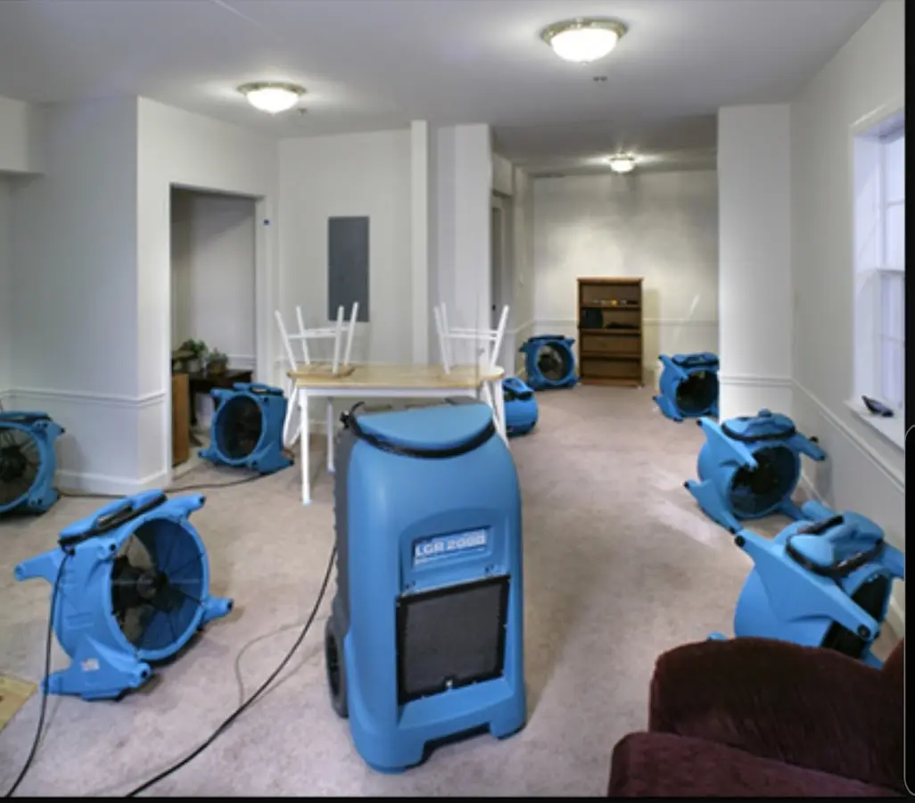 Air movers and dehumidifier setup for Water Damage Restoration in Laconia